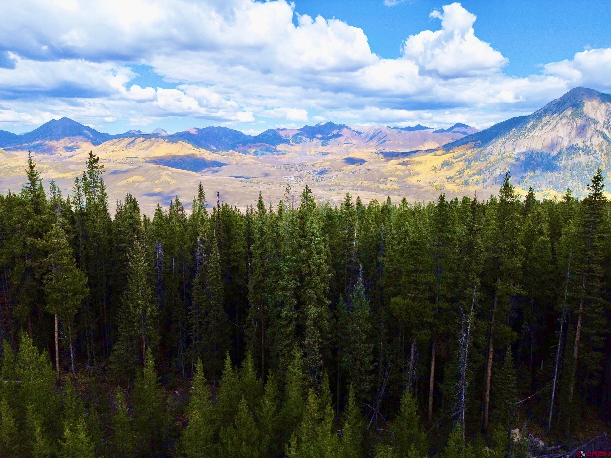 Saddle Ridge Road Crested Butte, CO 81224 - Photo 18 of 18 a view of a city with lots of residential buildings and mountain in the background