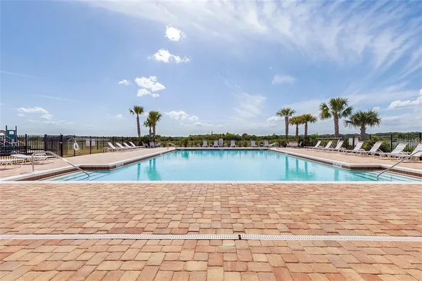 a view of a swimming pool with an ocean view