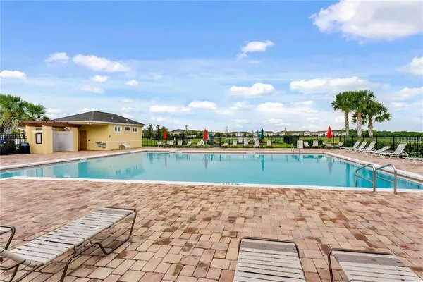 a view of swimming pool with a yard
