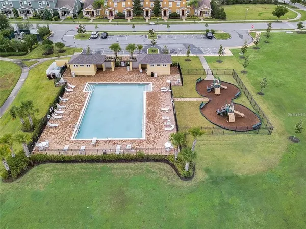 an aerial view of a house with outdoor space