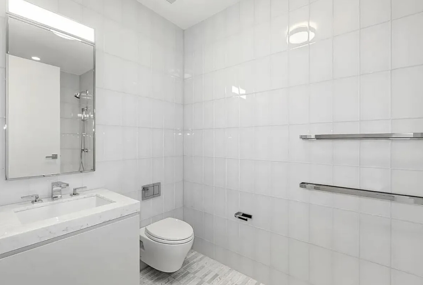 50 West 66th Street, Unit 9B Manhattan, NY 10023 - Photo 8 of 21 a bathroom with a sink toilet and shower