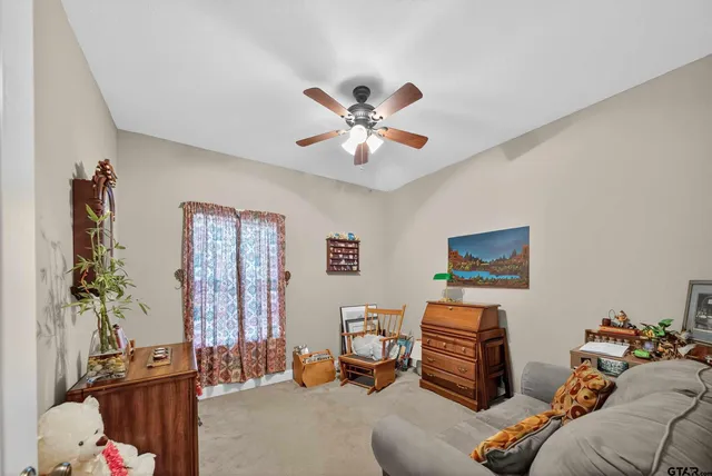 a bedroom with furniture and a chandelier