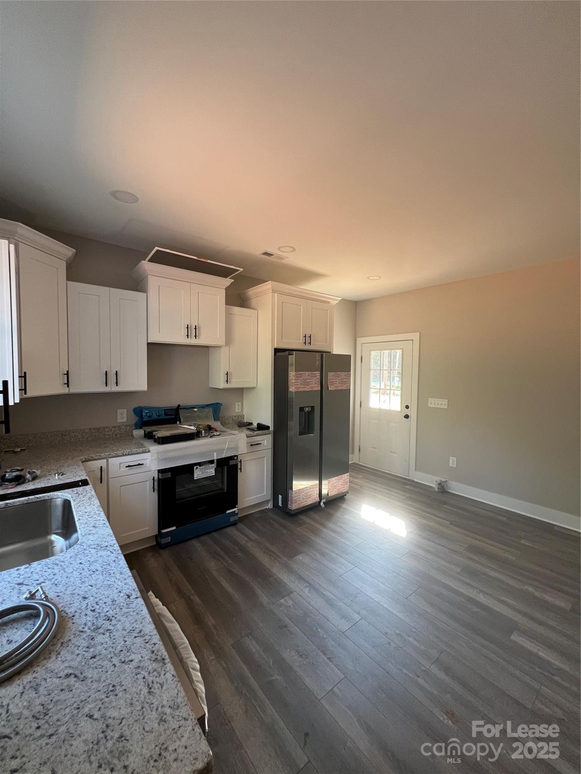 2009 Robert Rufty Lane Catawba, NC 28609 - Photo 6 of 17 a kitchen with granite countertop a stove a sink and a refrigerator