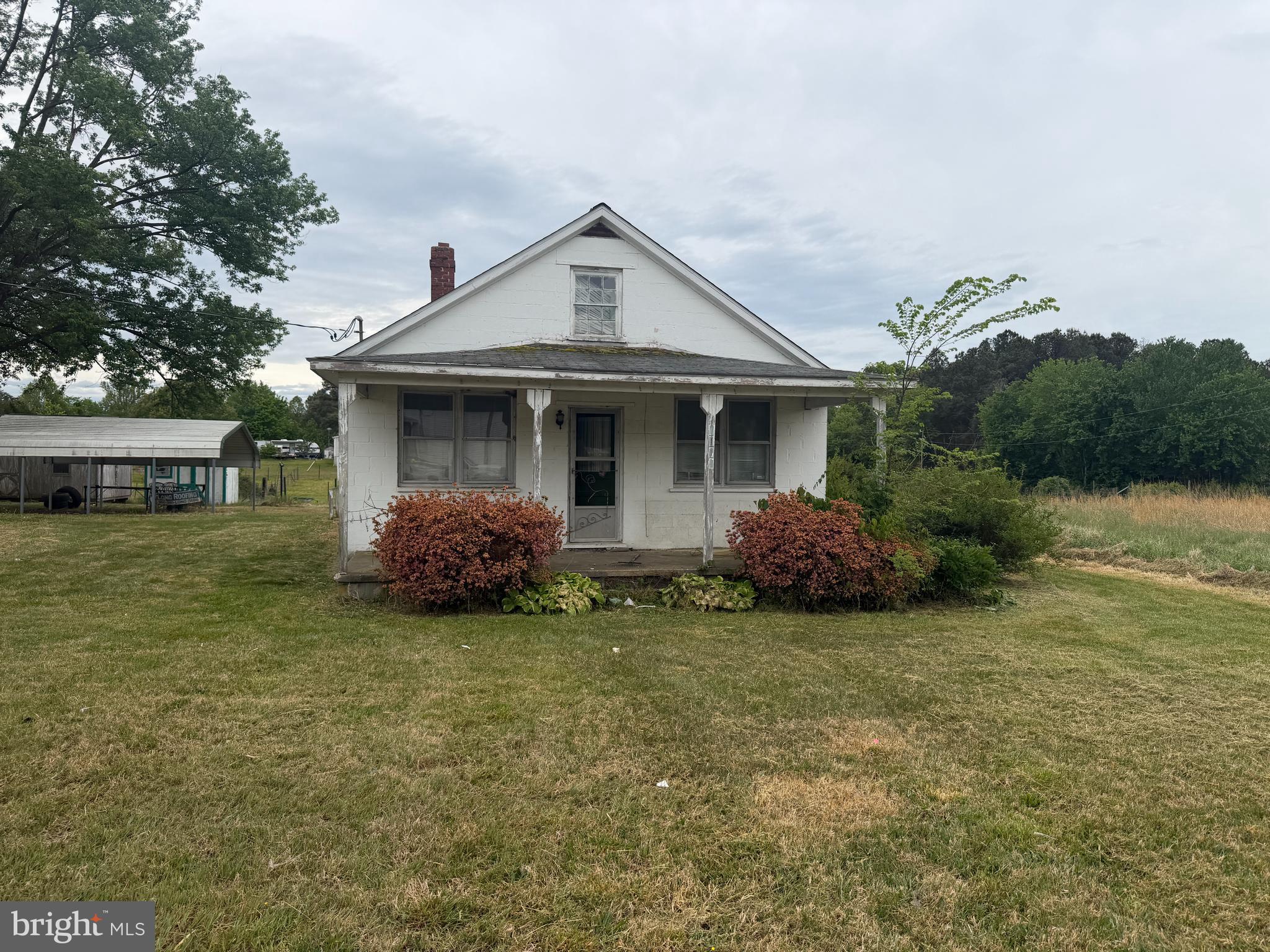 7114 Marye Road Spotsylvania, VA 22551 - Photo 2 of 11 a front view of a house with a garden
