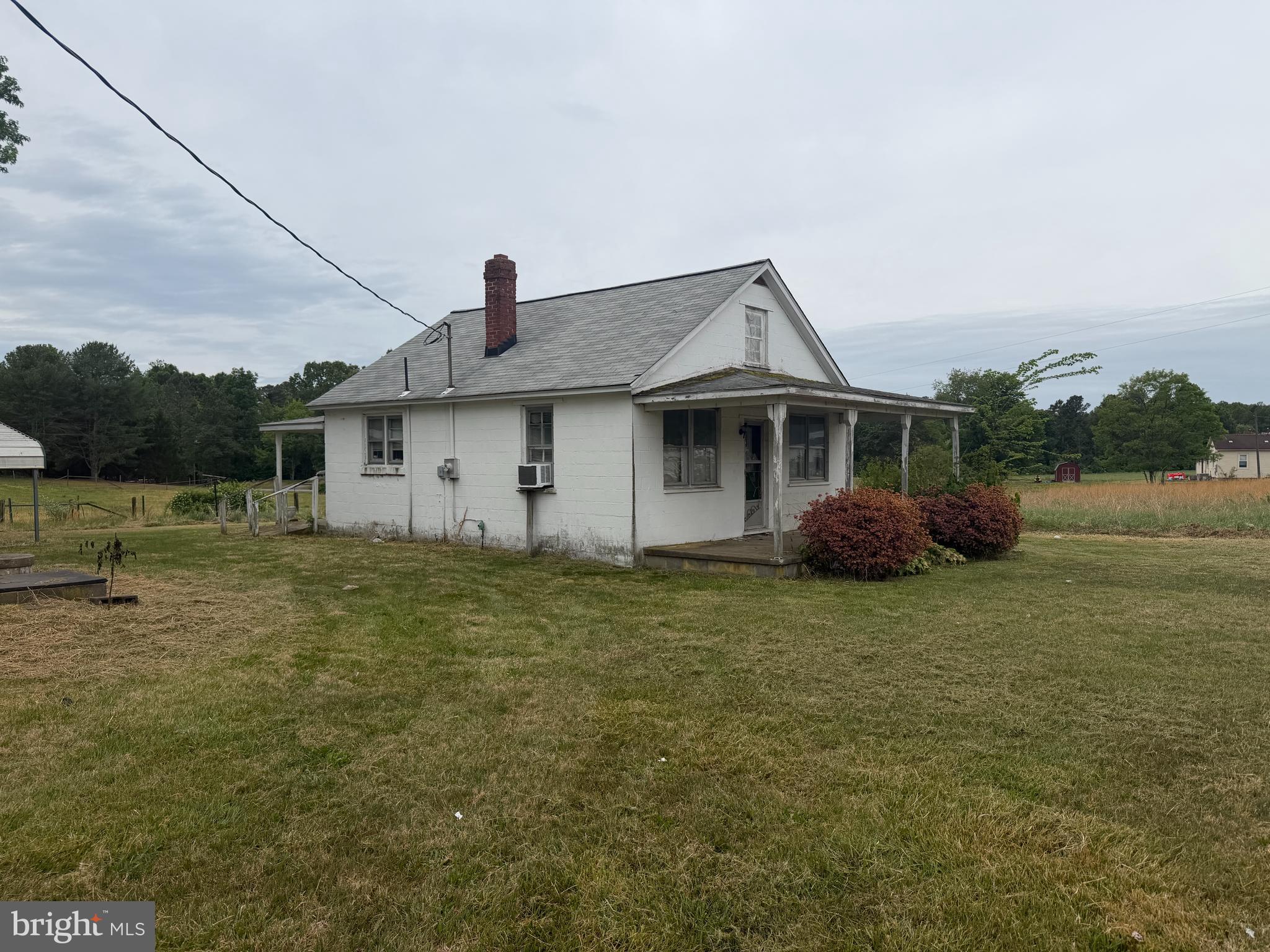 7114 Marye Road Spotsylvania, VA 22551 - Photo 3 of 11 a front view of a house with a garden