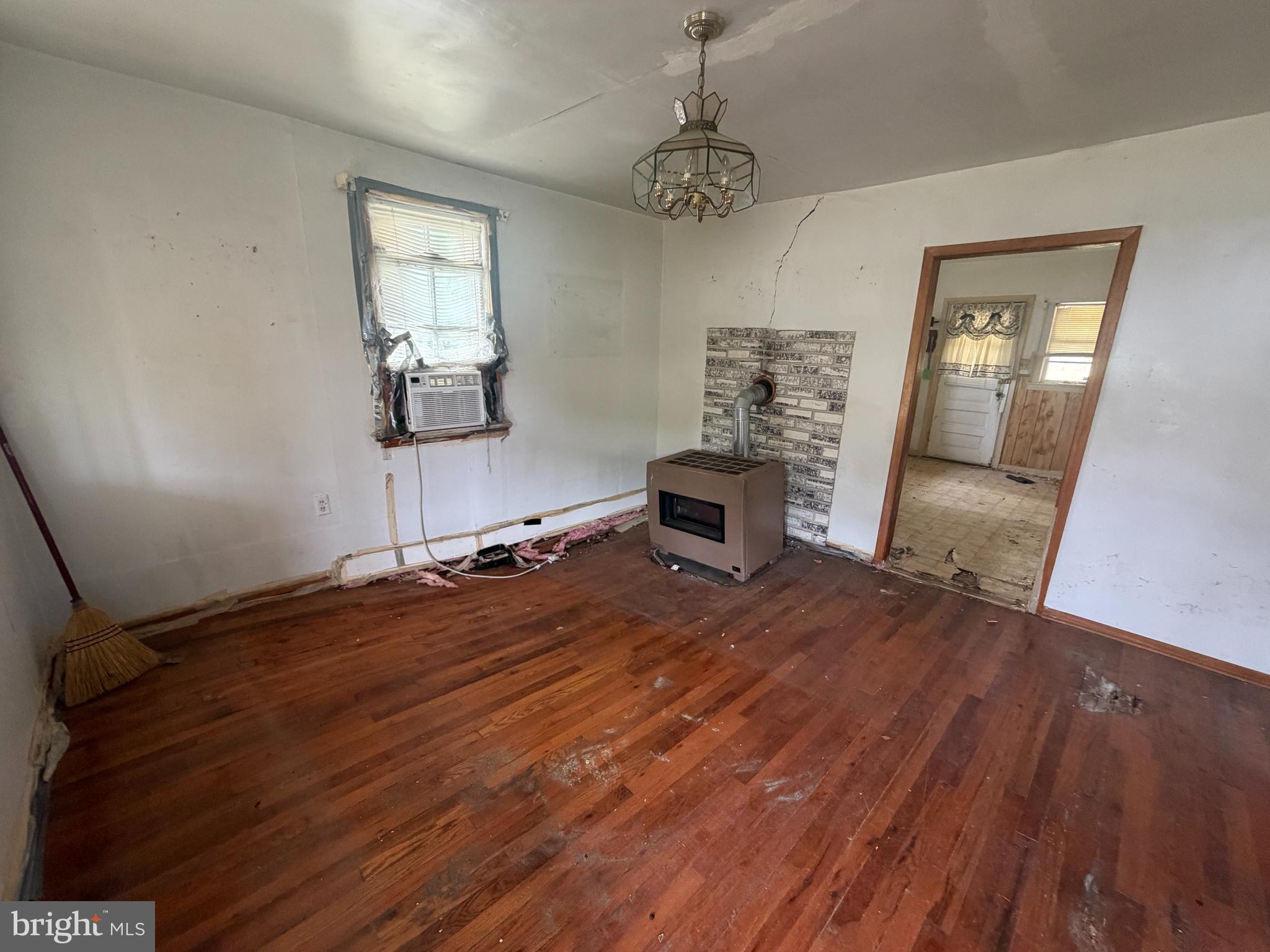 7114 Marye Road Spotsylvania, VA 22551 - Photo 6 of 11 a bedroom with a bed and wooden floor
