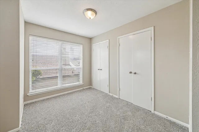 a bathroom with a granite countertop sink mirror and