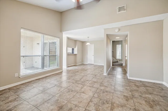 a kitchen with granite countertop a sink stove and cabinets