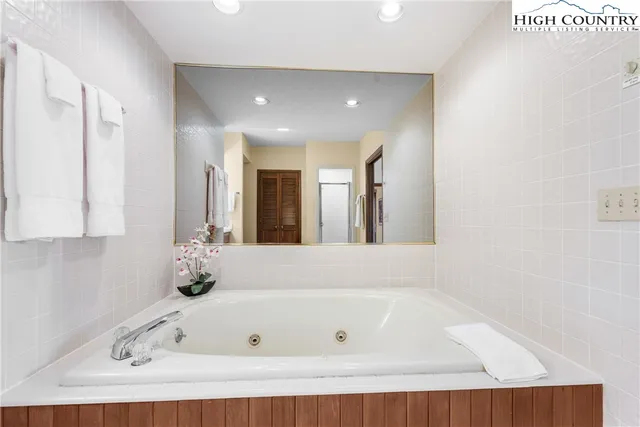 a spacious bathroom with a double vanity sink mirror and