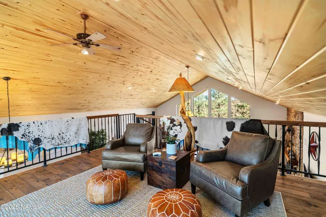 a view of balcony with wooden floor and outdoor seating