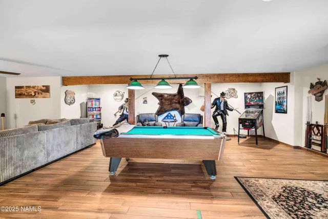 a living room with furniture a rug and a table