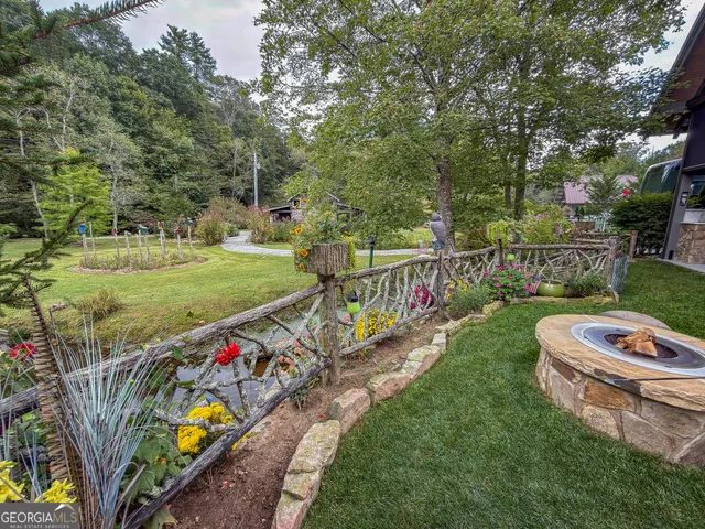 a view of a chairs and table in the balcony