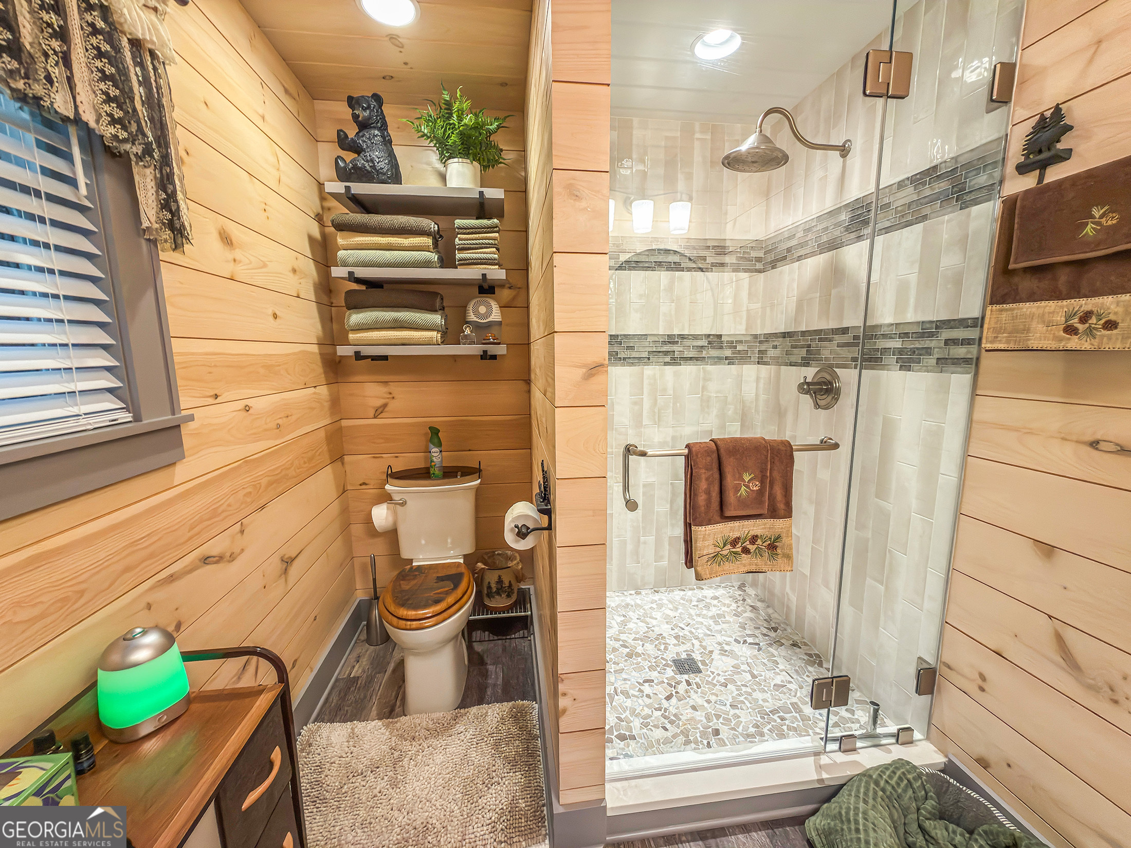 111 Wildflower Road Scaly Mountain, NC 28775 - Photo 16 of 52 a bathroom with a toilet and a shower