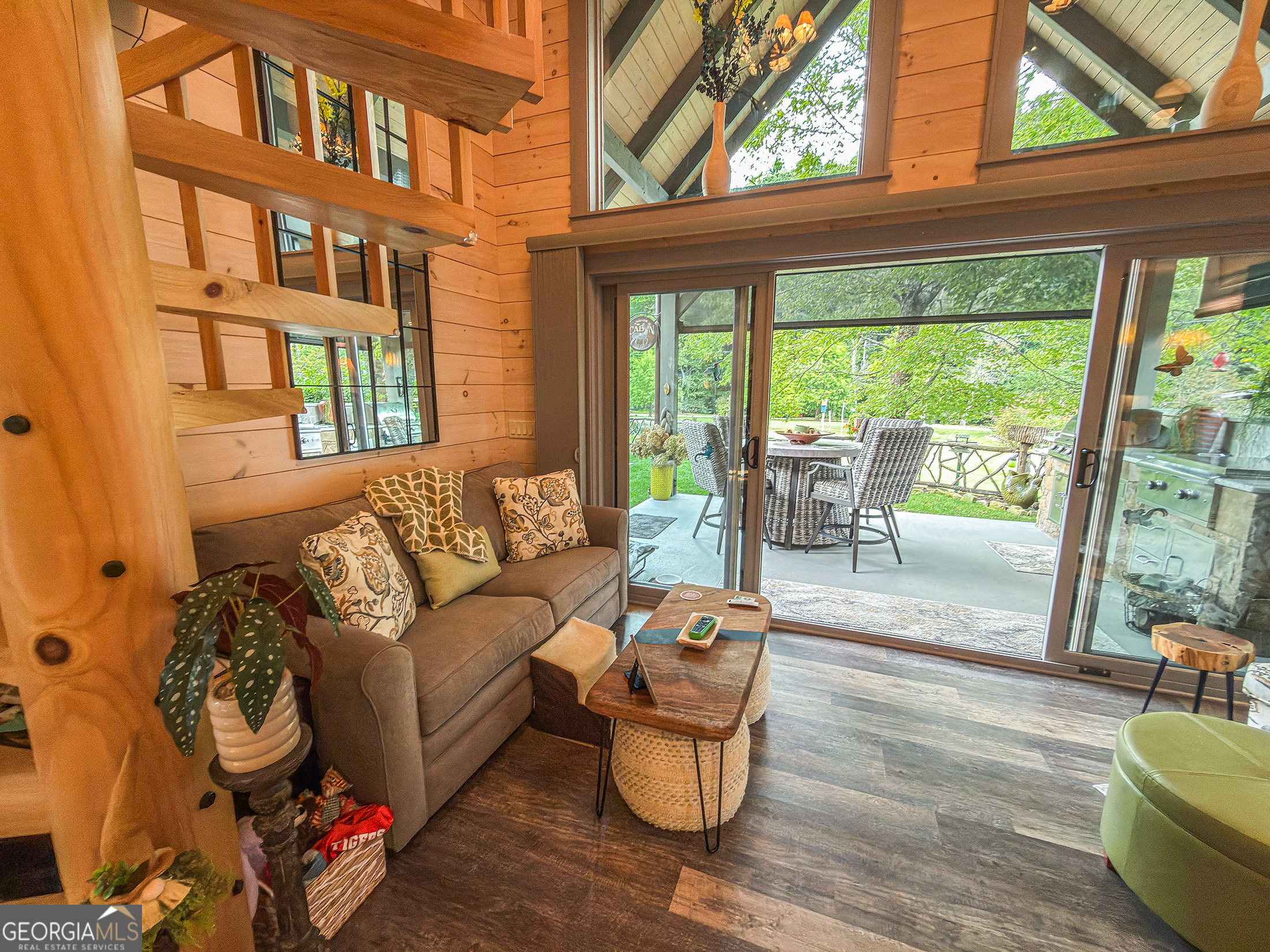 111 Wildflower Road Scaly Mountain, NC 28775 - Photo 25 of 52 a living room with furniture and a floor to ceiling window