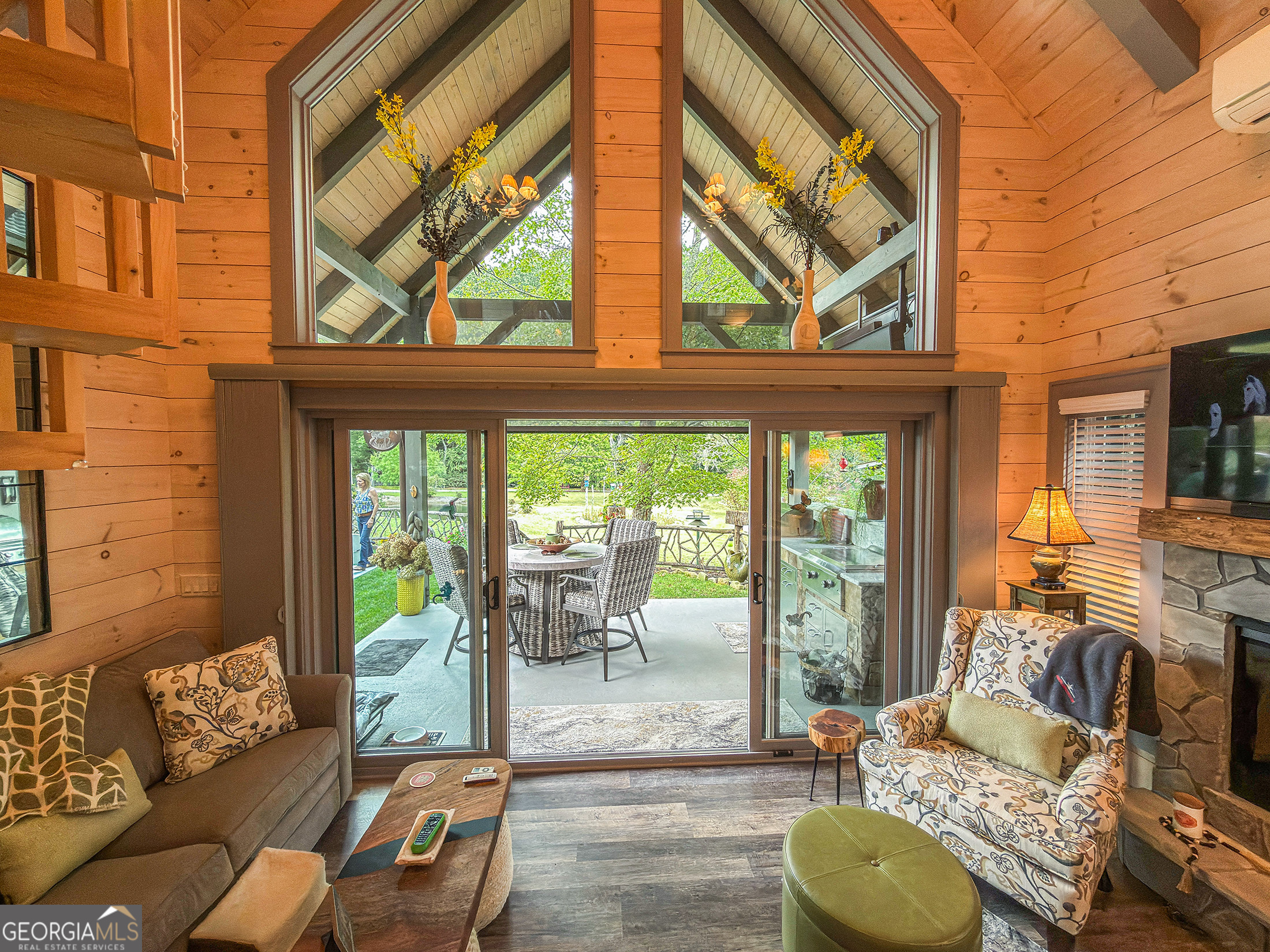 111 Wildflower Road Scaly Mountain, NC 28775 - Photo 26 of 52 a living room with furniture and a floor to ceiling window