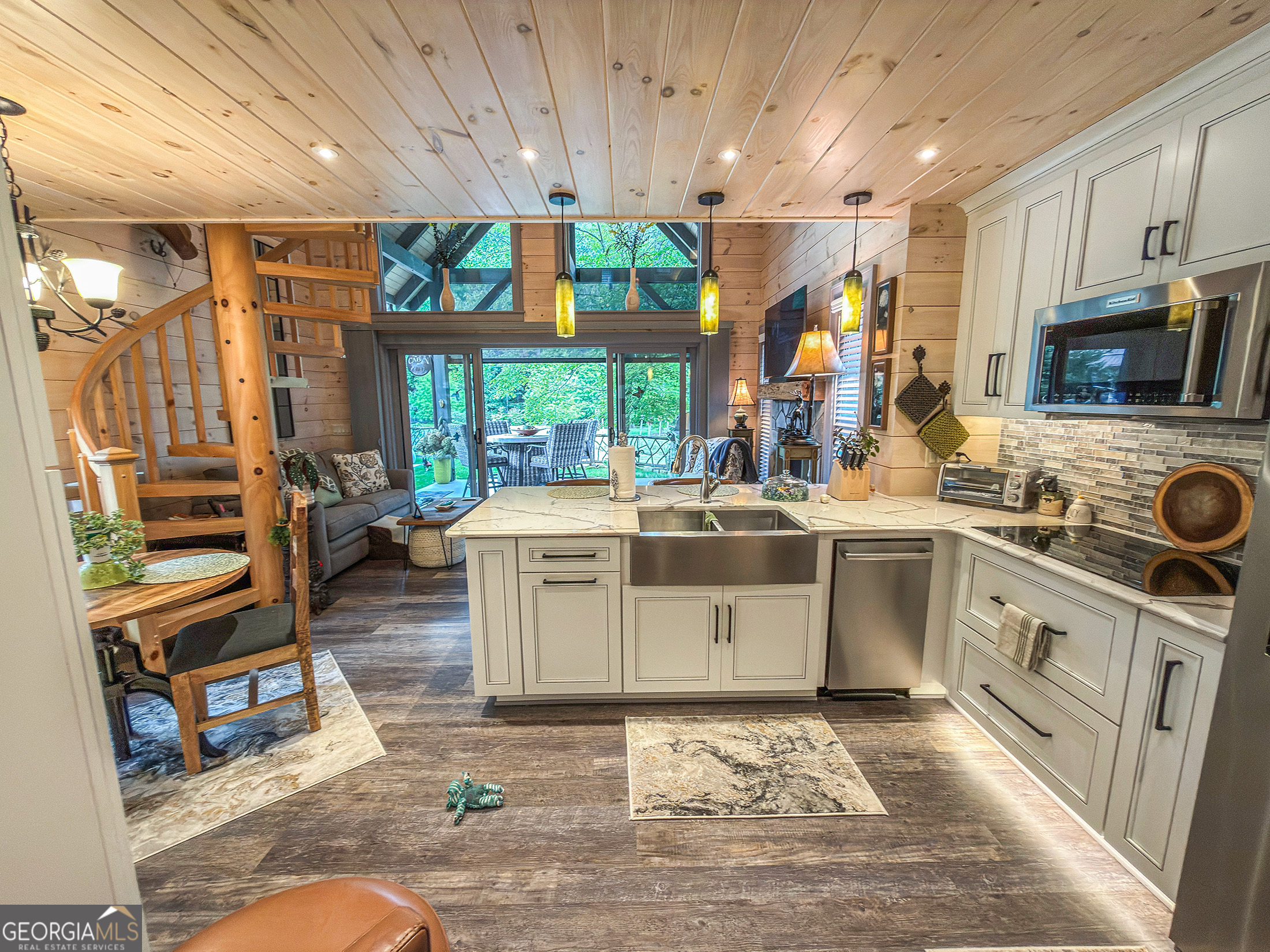 111 Wildflower Road Scaly Mountain, NC 28775 - Photo 30 of 52 a kitchen with stainless steel appliances kitchen island granite countertop a stove and a sink