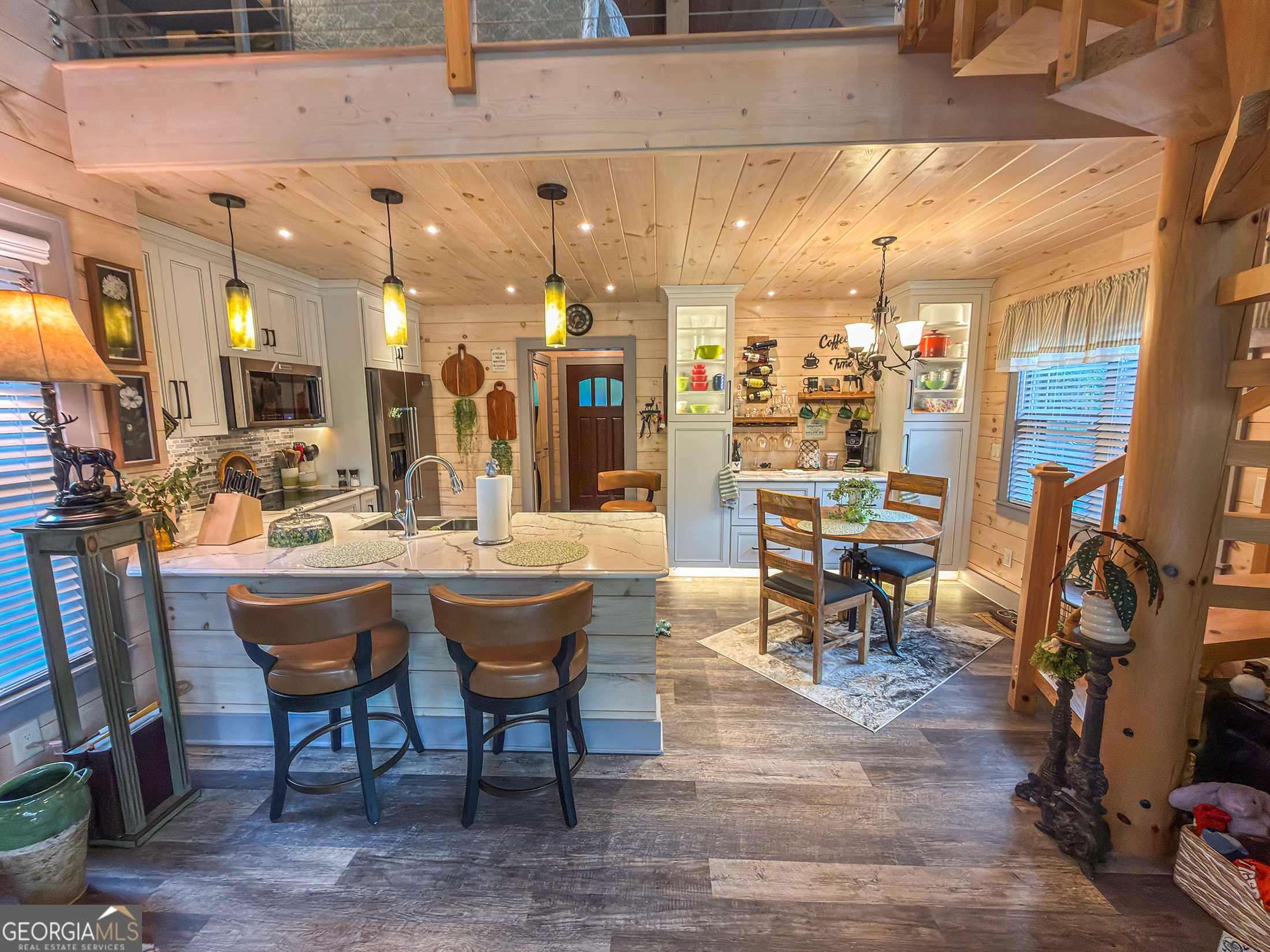 111 Wildflower Road Scaly Mountain, NC 28775 - Photo 31 of 52 a view of a dining room with furniture and chandelier
