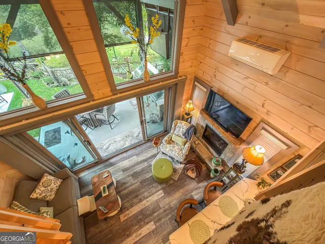 a view of an entryway with wooden floor