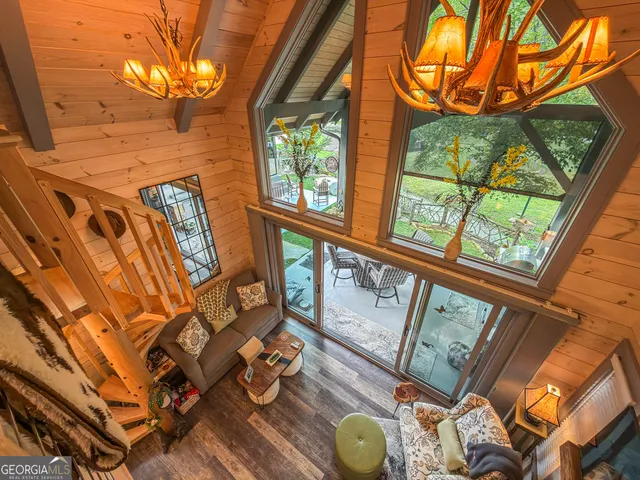 a living room with furniture a window and a couch