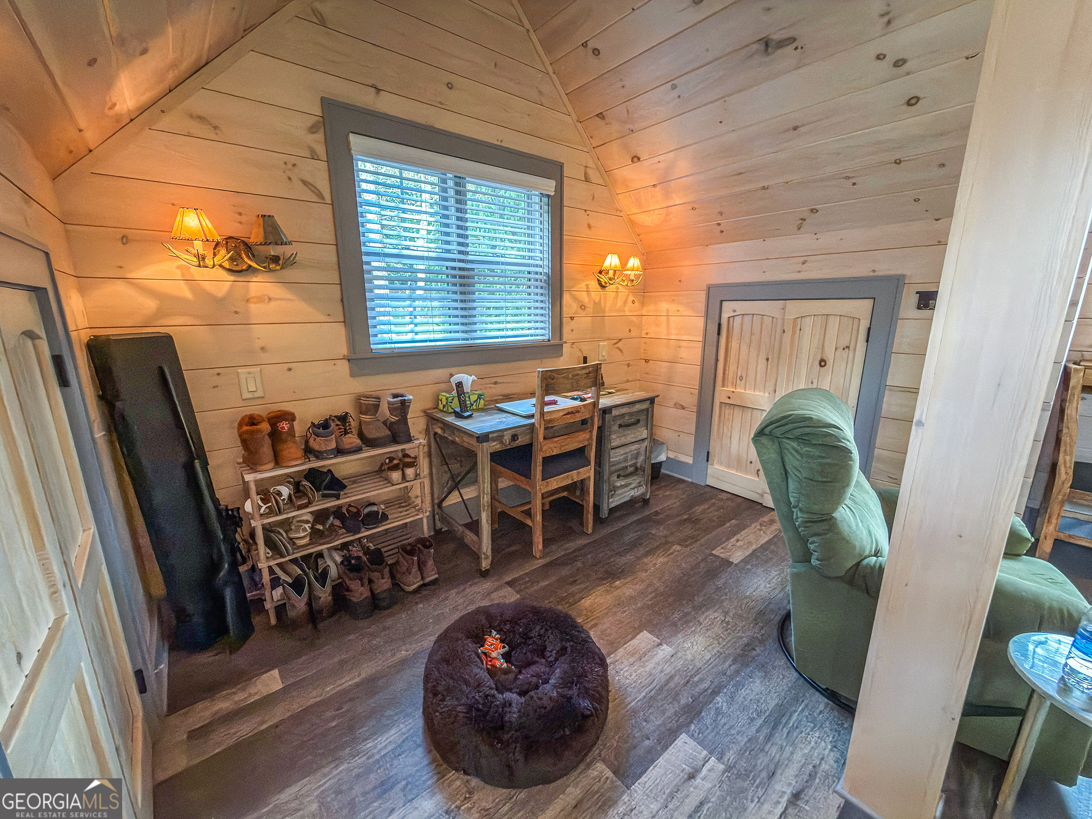 111 Wildflower Road Scaly Mountain, NC 28775 - Photo 38 of 52 a view of a dining room with furniture and wooden floor