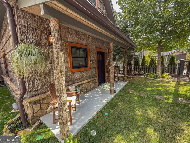 a view of a two chairs in the patio