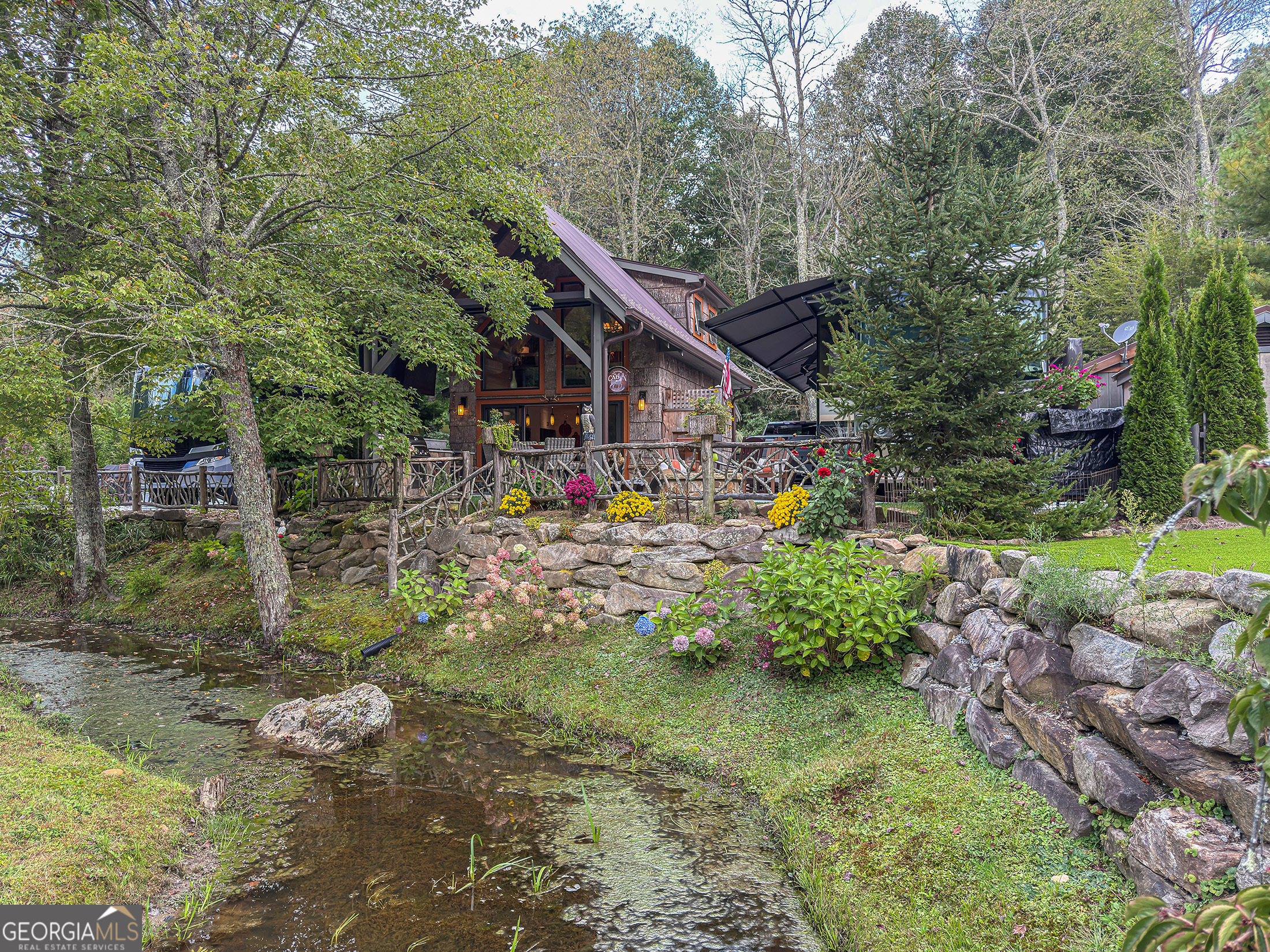 111 Wildflower Road Scaly Mountain, NC 28775 - Photo 48 of 52 a view of a back yard of the house