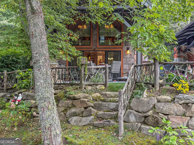a view of a cafe with a table and chairs in patio
