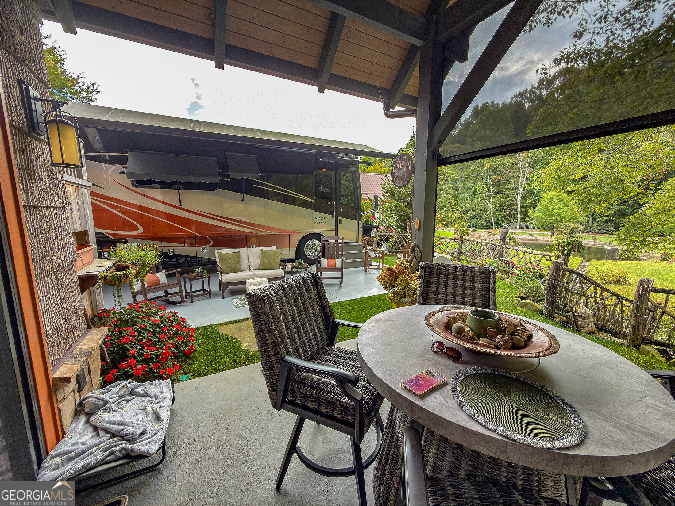 111 Wildflower Road Scaly Mountain, NC 28775 - Photo 7 of 52 a outdoor dining space with furniture and outdoor view
