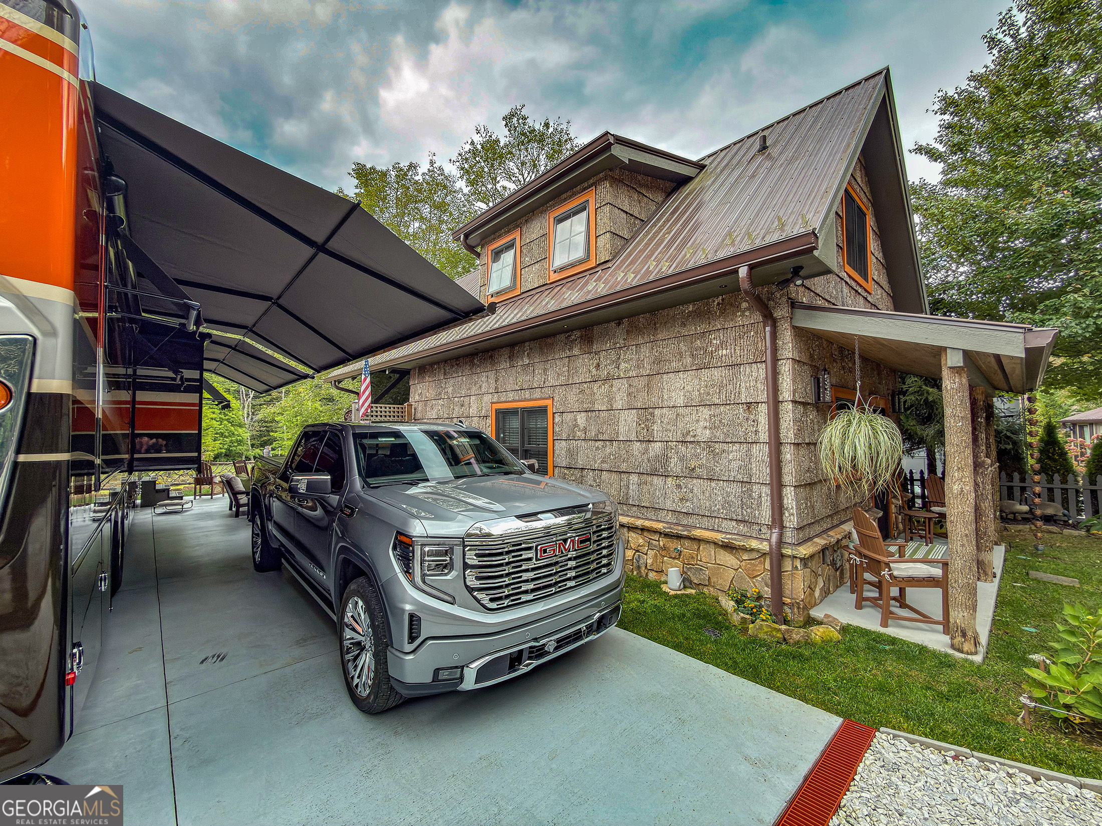 111 Wildflower Road Scaly Mountain, NC 28775 - Photo 8 of 52 a car parked in front of a house