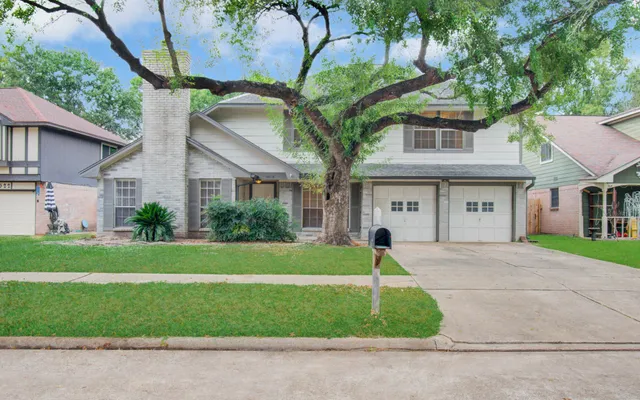 a house view with a garden space