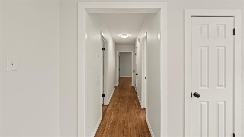 4600 Robinwood Drive Waco, TX 76708 - Photo 8 of 24 a view of a hallway with wooden floor