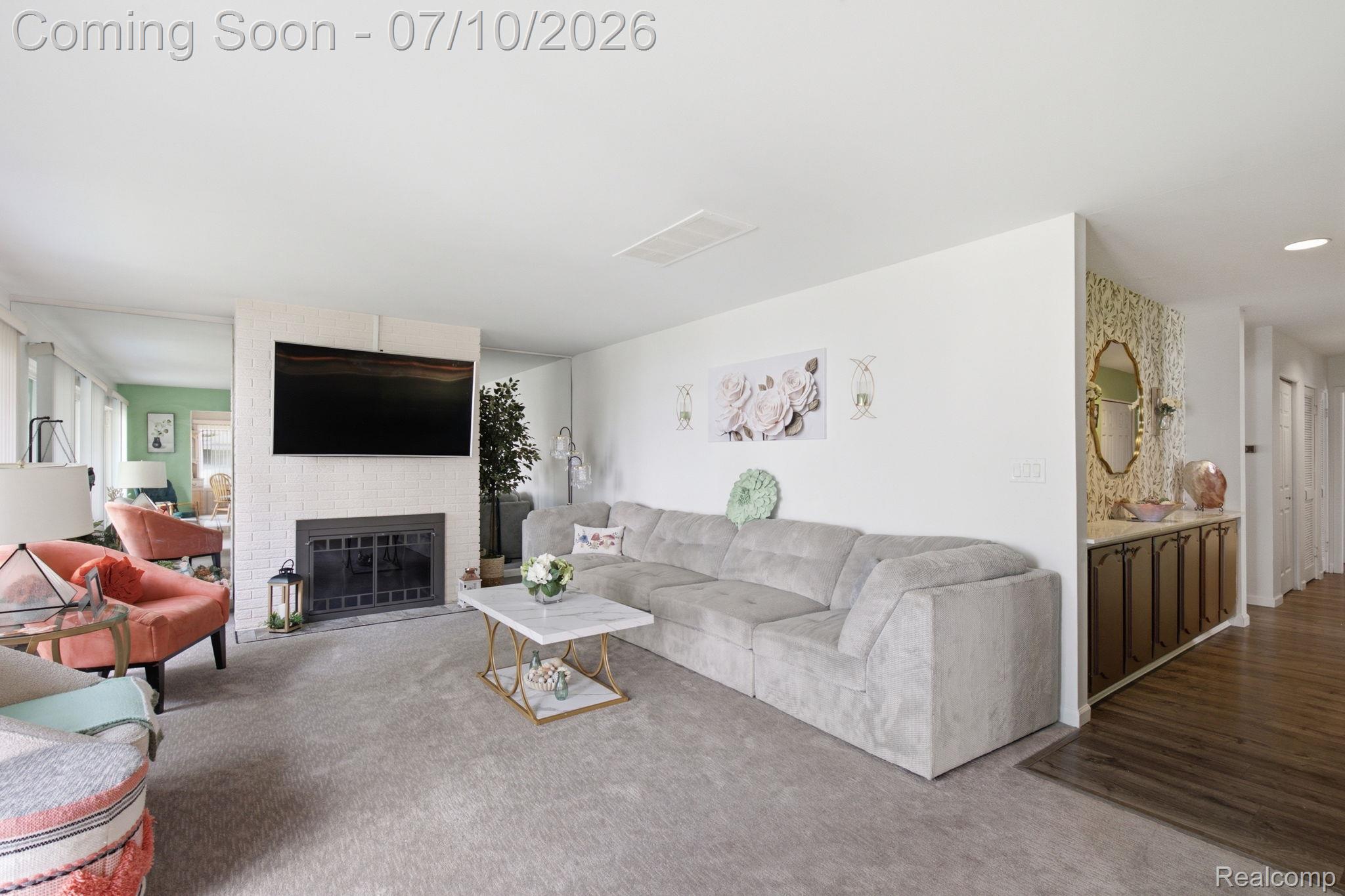 1501 River Road, Unit 301 St. Clair, MI 48079 - Photo 15 of 32 Open-concept living area featuring light-colored carpeting and white walls