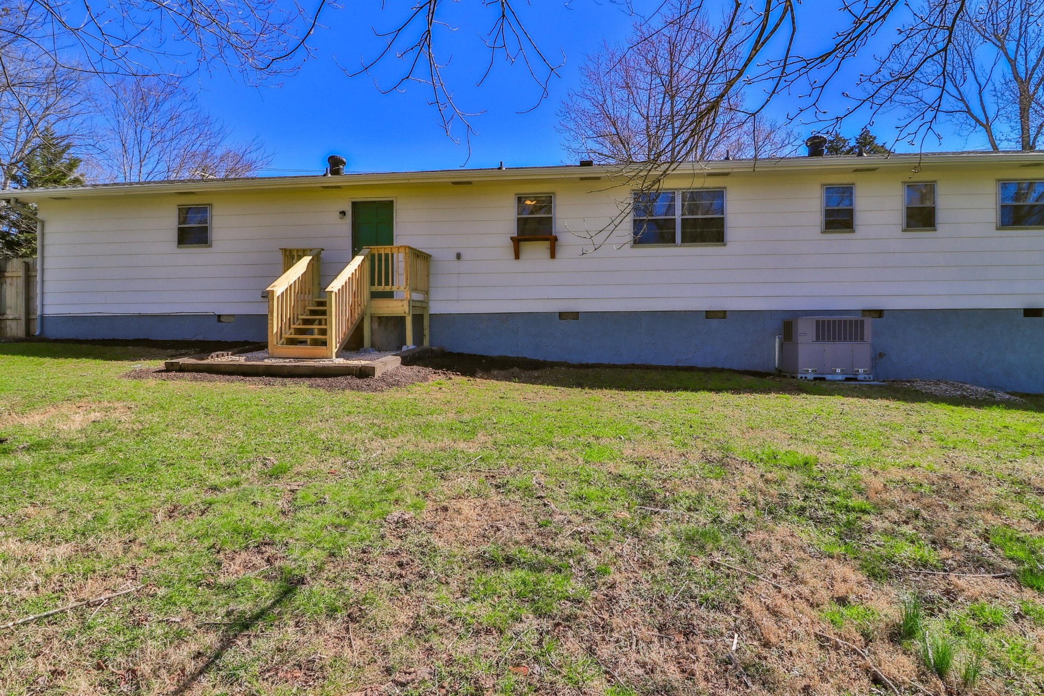 2701 Byington Beaver Ridge Road Knoxville, TN 37931 - Photo 23 of 29 a view of a backyard with table and chairs under an umbrella