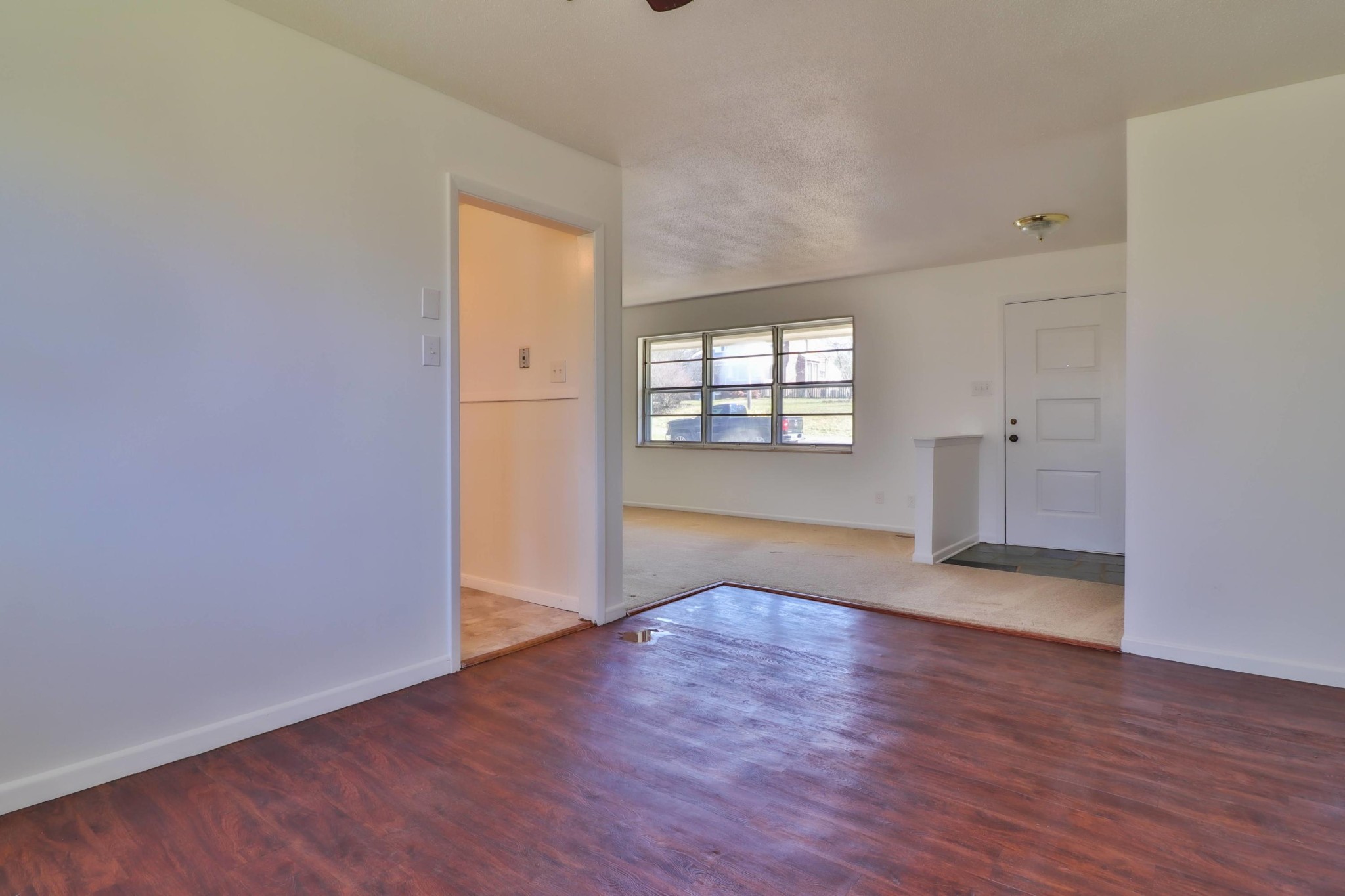 2701 Byington Beaver Ridge Road Knoxville, TN 37931 - Photo 7 of 29 an empty room with wooden floor and windows