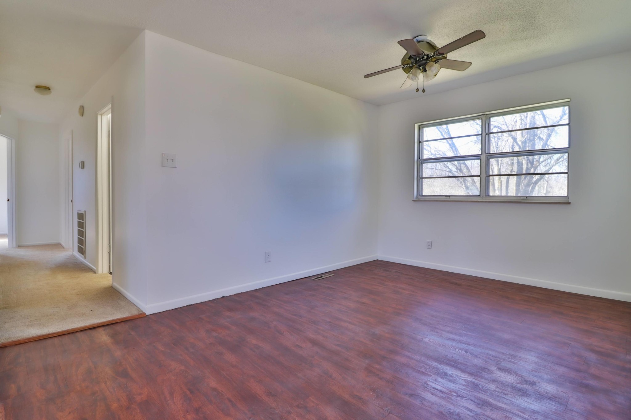2701 Byington Beaver Ridge Road Knoxville, TN 37931 - Photo 9 of 29 wooden floor in an empty room with a window
