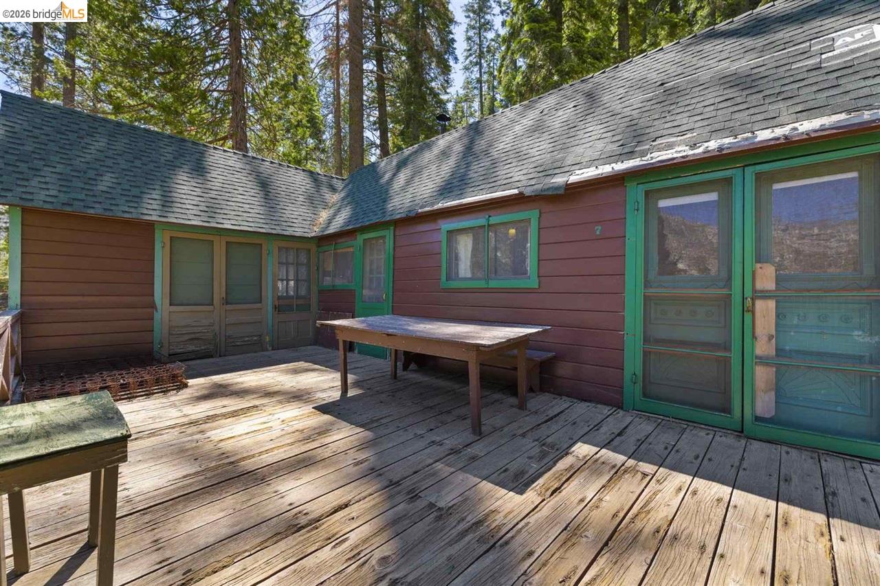 7 Riverside Tract Kyburz, CA 95720 - Photo 17 of 25 a backyard of a house with wooden floor yard and outdoor seating