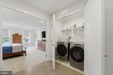 a view of a livingroom with furniture and washing machine