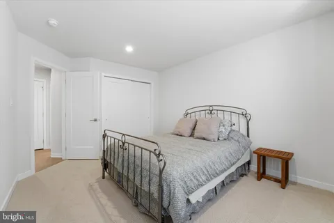 a bedroom with a bed and a table