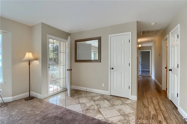 a view of a bathroom with mirror
