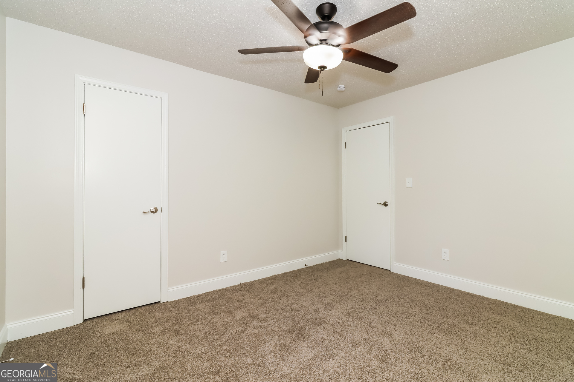 41 Valley Drive Hiram, GA 30141 - Photo 10 of 18 an empty room with a window and a fan