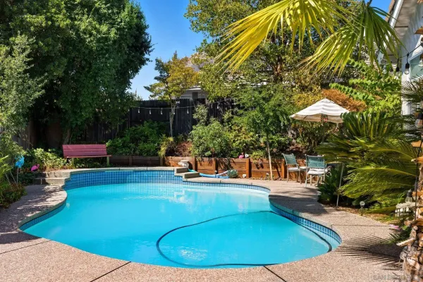 a view of a swimming pool with chairs