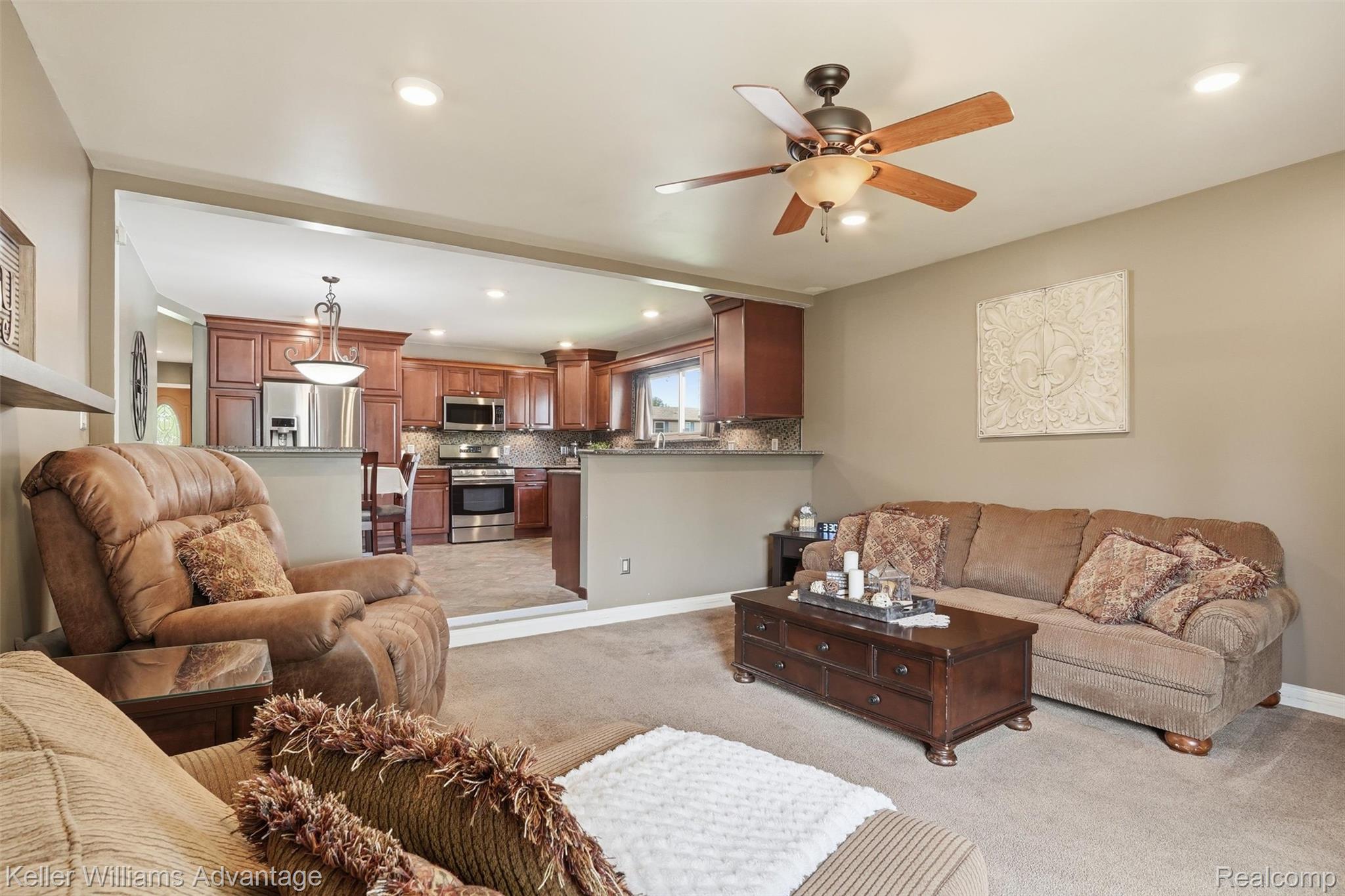 42505 Saltz Road Canton, MI 48187 - Photo 14 of 52 Living room with light carpet, a ceiling fan, and recessed lighting