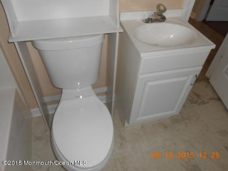 94 Club House Road Brick, NJ 08723 - Photo 4 of 4 a close view of a toilet in a bathroom