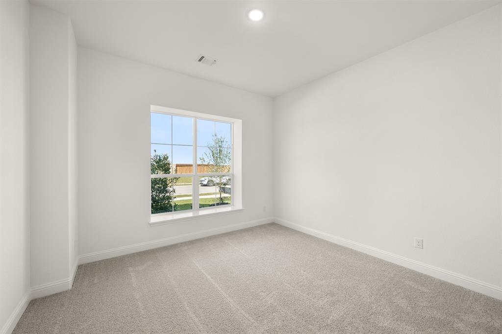 764 Texas Thistle Road Waxahachie, TX 75165 - Photo 15 of 30 a view of an empty room with a window