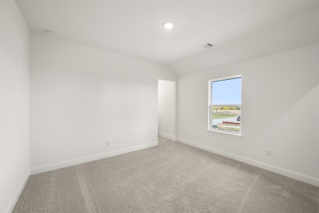 764 Texas Thistle Road Waxahachie, TX 75165 - Photo 18 of 30 an empty room with a window