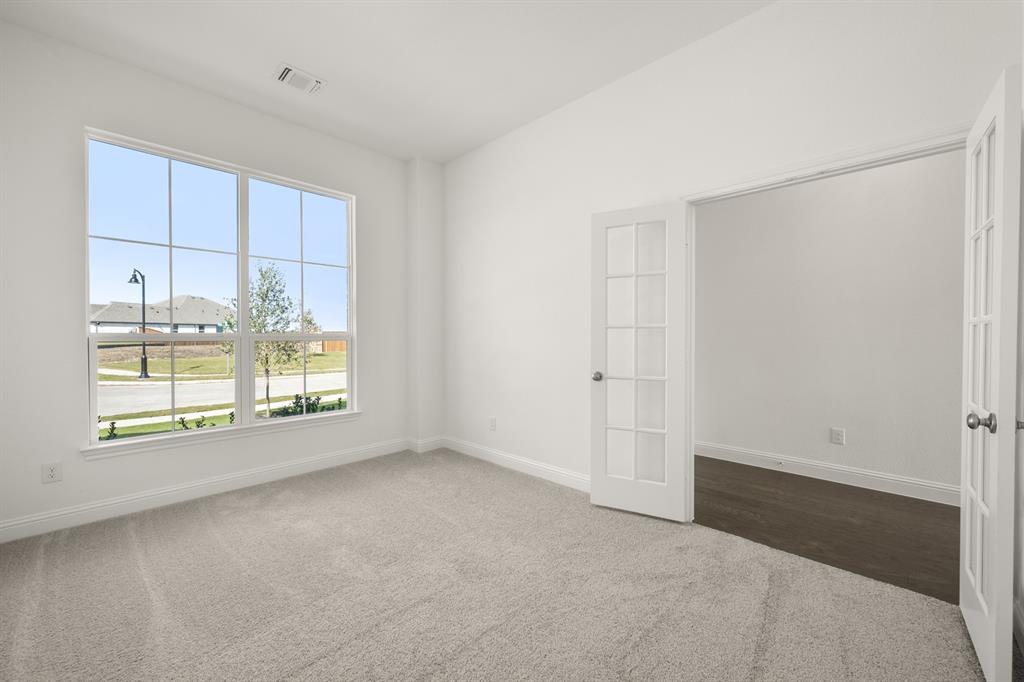 764 Texas Thistle Road Waxahachie, TX 75165 - Photo 21 of 30 an empty room with a window