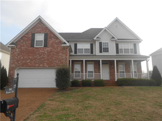 3047 Romain Trail Spring Hill, TN 37174 - Photo 19 of 19 a front view of a house with a garden and garage