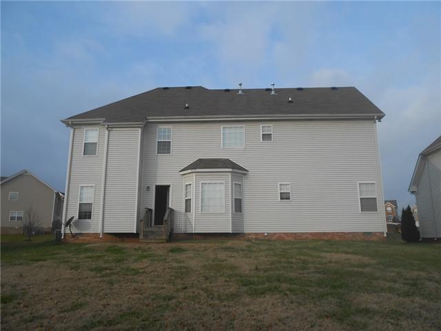 3047 Romain Trail Spring Hill, TN 37174 - Photo 2 of 19 a view of a back yard of the house