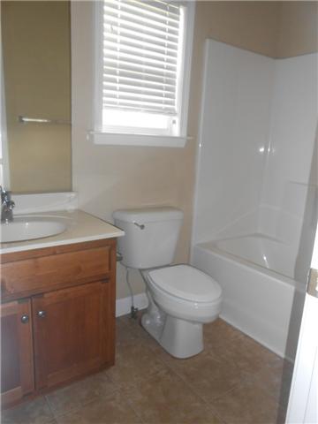 3047 Romain Trail Spring Hill, TN 37174 - Photo 5 of 19 a bathroom with a sink a toilet and a bathtub