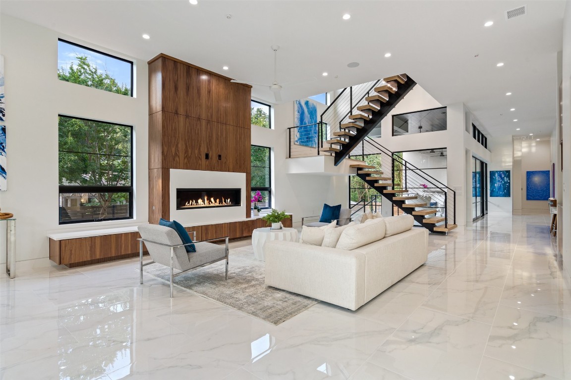 1605 Barn Swallow Drive Austin, TX 78746 - Photo 1 of 1 a living room with furniture and a wooden floor